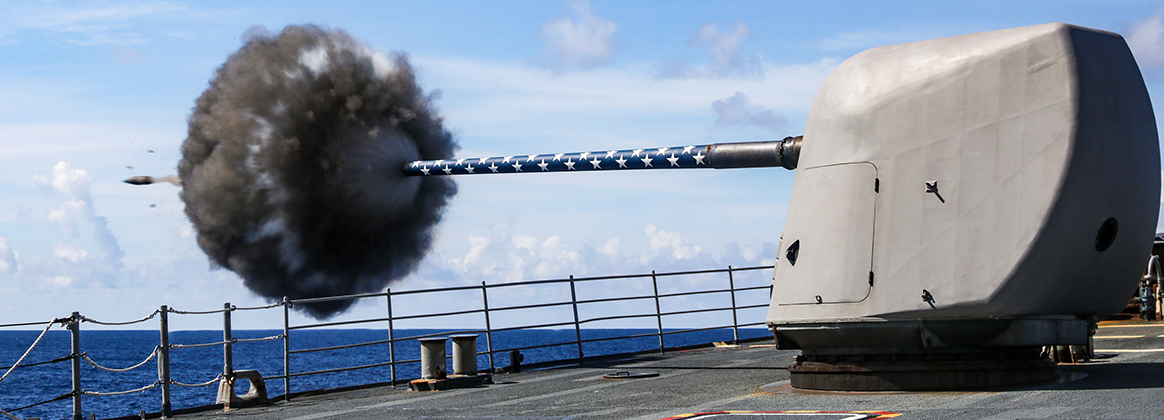The Ticonderoga-class guided-missile cruiser USS Princeton (CG 59) fires its forward Mark 45 5-inch gun during a weapons maintenance shoot, July 29, 2025.
